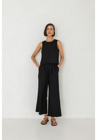 SPODNIE CARA CZARNE XS - Flawless. Okazja: na co dzień. Kolor: czarny. Materiał: len, skóra, tkanina. Długość: do kostek. Sezon: lato. Styl: klasyczny, casual