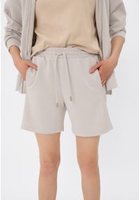Volcano - Sportowe szorty M-LOTIZ. Kolor: beżowy. Materiał: poliester, elastan, tkanina, dresówka, materiał, włókno, wiskoza. Długość: krótkie. Wzór: napisy, gładki. Styl: sportowy #1