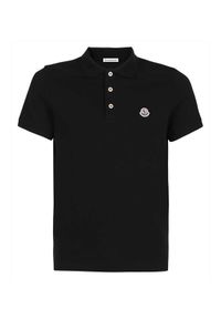 MONCLER - Czarny t-shirt polo. Typ kołnierza: polo. Kolor: czarny. Materiał: bawełna. Wzór: aplikacja. Styl: klasyczny