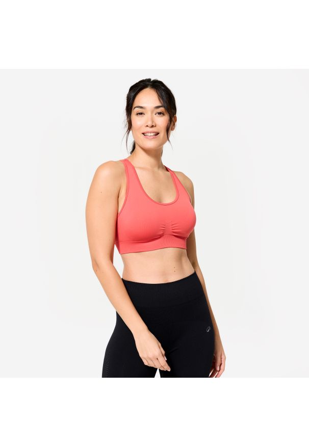 Decathlon - Stanik sportowy Kimjaly. Kolor: różowy. Materiał: materiał, skóra. Rodzaj stanika: wyciągane miseczki. Sport: joga i pilates