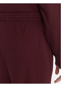 TOMMY HILFIGER - Tommy Hilfiger Spodnie dresowe UW0UW06081 Bordowy Wide Leg. Kolor: czerwony. Materiał: bawełna