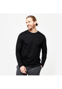 DOMYOS - Koszulka z długim rękawem męska Domyos Gym & Pilates 100. Kolor: czarny. Materiał: materiał, prążkowany, bawełna, tkanina, elastan. Długość rękawa: długi rękaw. Długość: długie. Wzór: ze splotem. Sport: joga i pilates