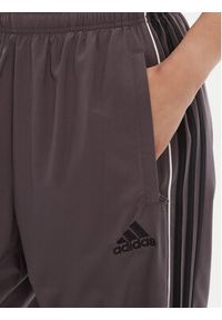 Adidas - adidas Spodnie dresowe Teamgeist adicolor JW5870 Szary Loose Fit. Kolor: szary. Materiał: syntetyk #3