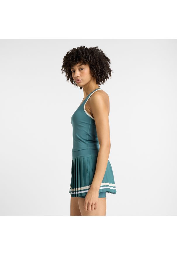 Koszulka damska New Balance WT51401NUS – niebieska. Kolor: niebieski. Materiał: materiał, tkanina, poliester. Wzór: aplikacja. Sport: tenis