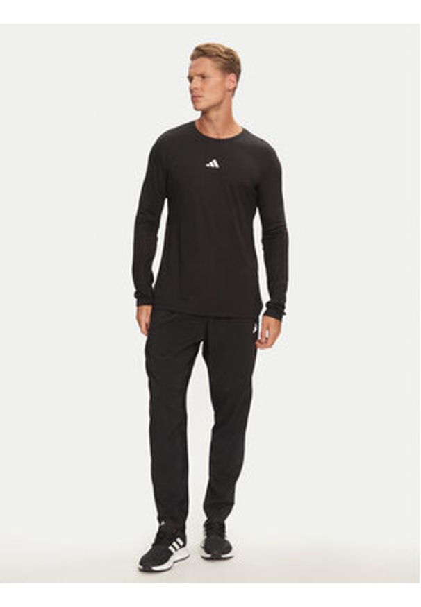 Adidas - adidas Spodnie dresowe Own The Run IK5024 Czarny Regular Fit. Kolor: czarny. Materiał: syntetyk. Sport: bieganie