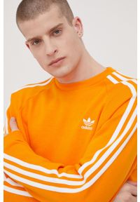adidas Originals bluza Adicolor męska kolor pomarańczowy z aplikacją. Kolor: pomarańczowy. Materiał: poliester, bawełna. Długość rękawa: raglanowy rękaw. Wzór: aplikacja