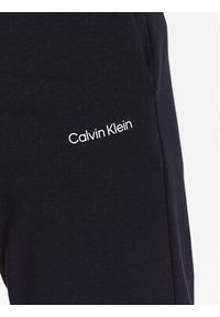 Calvin Klein Spodnie dresowe Micro Logo K10K109940 Granatowy Regular Fit. Kolor: niebieski. Materiał: syntetyk, dresówka, bawełna