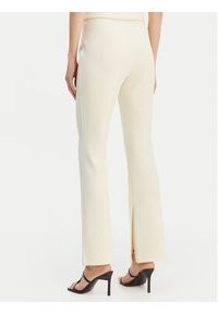 Calvin Klein Spodnie materiałowe LV044B223G Beżowy Flare Fit. Kolor: beżowy. Materiał: syntetyk #4