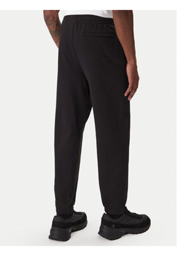 Calvin Klein Jeans Spodnie dresowe GSM LV04RD252G Czarny Regular Fit. Kolor: czarny. Materiał: bawełna