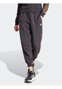 Adidas - adidas Spodnie dresowe Essentials 3-Stripes IS2155 Czarny Loose Fit. Kolor: czarny. Materiał: bawełna