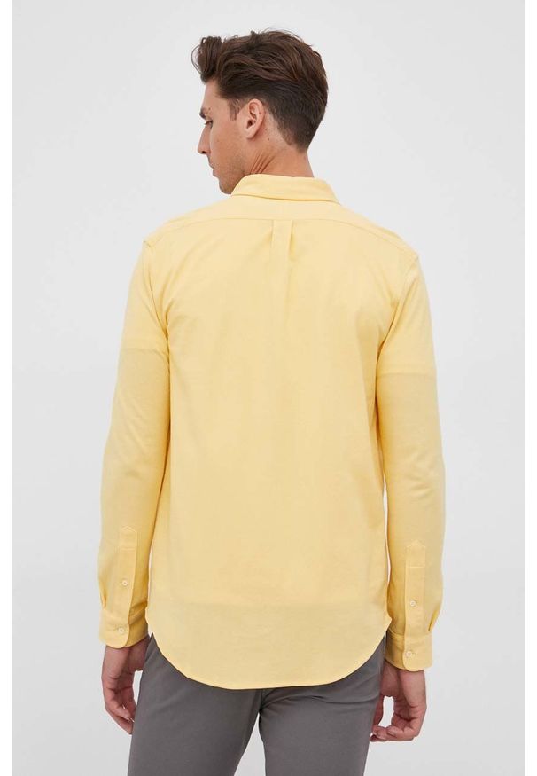 Polo Ralph Lauren Koszula bawełniana męska kolor żółty regular z kołnierzykiem button-down. Okazja: na co dzień. Typ kołnierza: polo, button down. Kolor: żółty. Materiał: bawełna. Długość rękawa: długi rękaw. Długość: długie. Wzór: aplikacja. Styl: casual