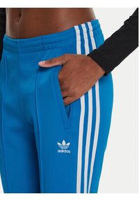 Adidas - adidas Spodnie dresowe adicolor SST IL8817 Niebieski Slim Fit. Kolor: niebieski. Materiał: bawełna #3