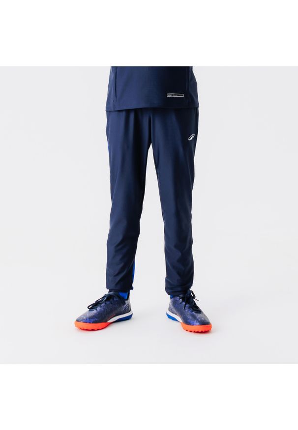 KIPSTA - Spodnie do piłki nożnej dla dzieci Kipsta Viralto Club. Kolor: niebieski. Materiał: poliester, materiał, elastan. Sport: piłka nożna