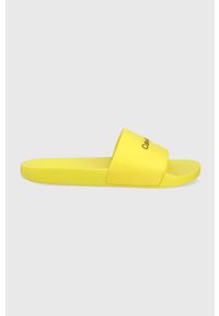 Calvin Klein klapki męskie kolor żółty. Kolor: żółty. Materiał: materiał. Obcas: na obcasie. Wysokość obcasa: niski