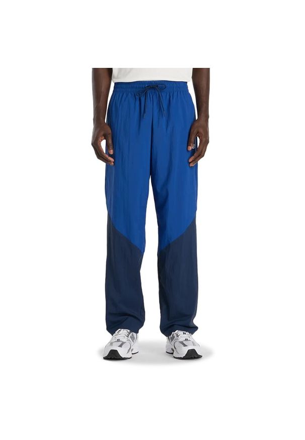 Spodnie męskie New Balance MB61R010NNY - niebieskie. Kolor: niebieski. Materiał: materiał, poliester