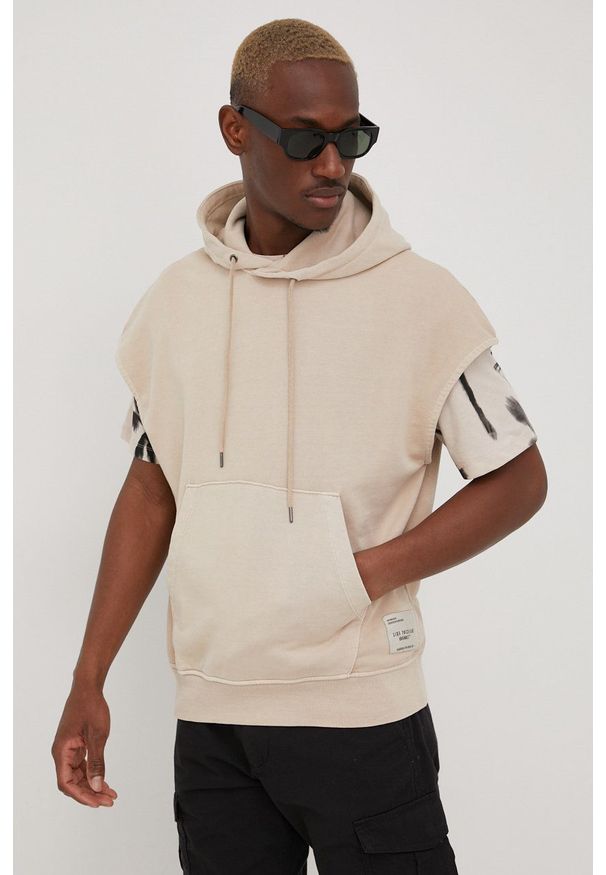 Jack & Jones kamizelka bawełniana męska kolor beżowy z kapturem gładka. Typ kołnierza: kaptur. Kolor: beżowy. Materiał: bawełna. Wzór: gładki