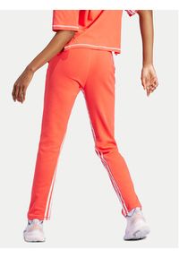Adidas - adidas Spodnie dresowe Dance All-Gender Versatile IS0897 Pomarańczowy Regular Fit. Kolor: pomarańczowy. Materiał: bawełna