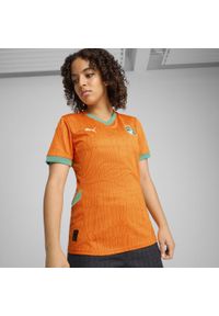 Puma - Damska koszulka domowa Wybrzeże Kości Słoniowej 2025 PUMA. Kolor: zielony, pomarańczowy, wielokolorowy, żółty. Wzór: aplikacja. Sport: piłka nożna