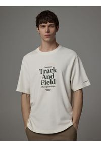 Reserved - T-shirt relaxed z nadrukiem - złamana biel. Materiał: bawełna, dzianina. Wzór: nadruk #1