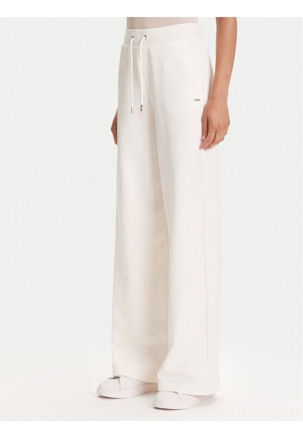 Guess Spodnie dresowe V5YB19 KBSL2 Écru Regular Fit. Materiał: syntetyk