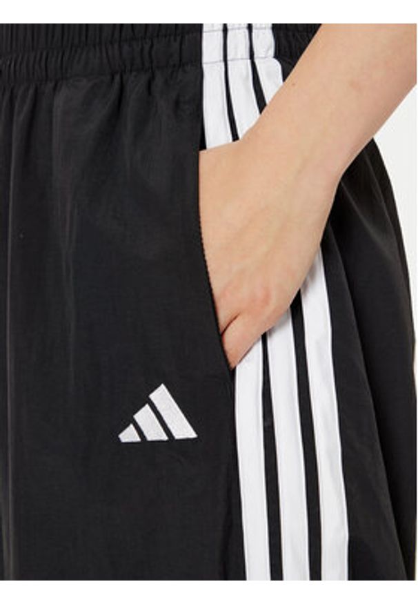 Adidas - adidas Spodnie dresowe Essentials 3-Stripes JE1306 Czarny Loose Fit. Kolor: czarny. Materiał: syntetyk