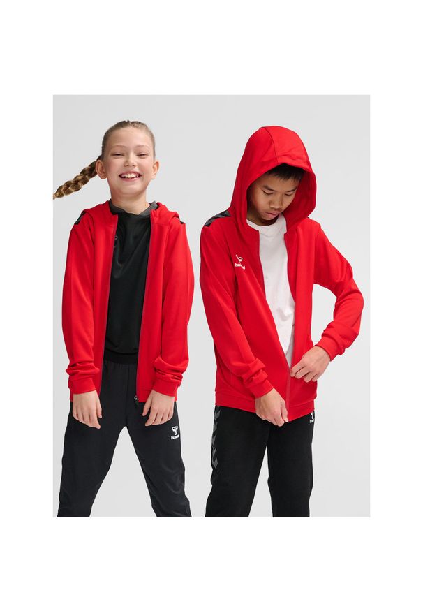 Dziecięca poliestrowa kurtka dresowa z kapturem i zamkiem błyskawicznym Hummel A. Typ kołnierza: kaptur. Kolor: wielokolorowy, czerwony, różowy. Materiał: dresówka, poliester. Sport: joga i pilates