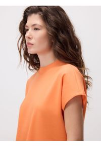 Reserved - T-shirt z raglanowym rękawem - pomarańczowy. Kolor: pomarańczowy. Materiał: dzianina, bawełna. Długość rękawa: raglanowy rękaw. Wzór: gładki