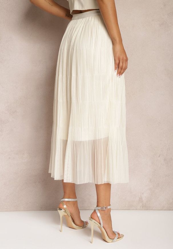 Renee - Jasnobeżowa Rozkloszowana Spódnica z Tiulu Wykończona Gumką w Pasie Risshara. Okazja: na co dzień. Kolor: beżowy. Materiał: tiul. Styl: elegancki, casual