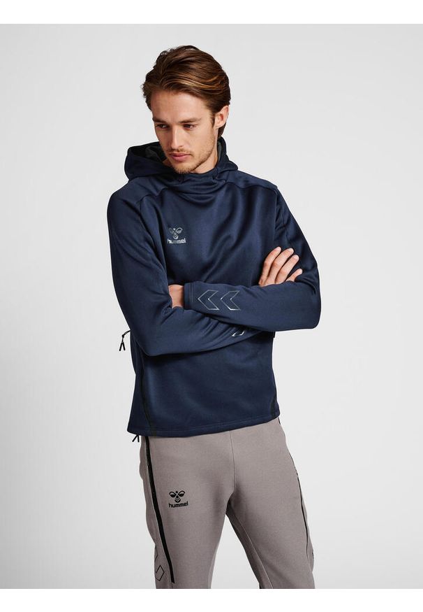 Bluza z kapturem Hummel Cima XK. Typ kołnierza: kaptur. Kolor: niebieski. Materiał: materiał. Wzór: nadruk