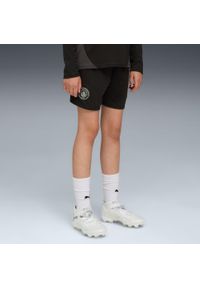 Puma - Krótka koszulka treningowa dla dzieci Manchester City 2025/26. Kolor: czarny. Długość: krótkie. Styl: sportowy, młodzieżowy