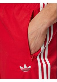Adidas - adidas Spodnie dresowe Firebird Woven KE1369 Czerwony Regular Fit. Kolor: czerwony. Materiał: syntetyk #4