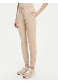 Guess Spodnie dresowe V3BB27 K0232 Beżowy Regular Fit. Kolor: beżowy. Materiał: syntetyk