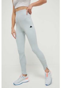 Adidas - adidas legginsy Z.N.E damskie kolor zielony gładkie. Stan: podwyższony. Kolor: zielony. Materiał: skóra, dzianina, materiał. Wzór: gładki. Sport: fitness #1