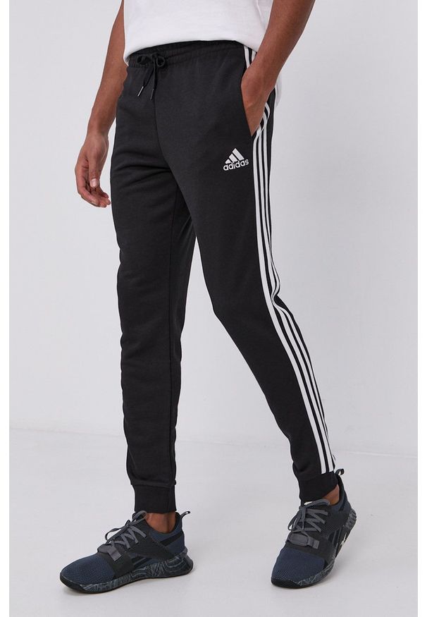 Adidas - adidas Spodnie GK8831 męskie kolor czarny gładkie. Kolor: czarny. Materiał: poliester, dzianina. Wzór: gładki