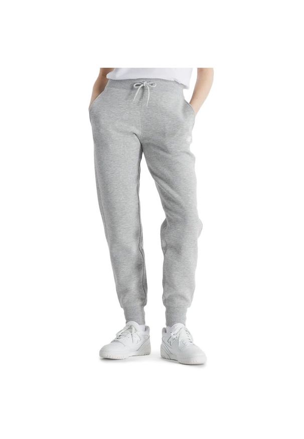 Spodnie New Balance WP43805AG - szare. Stan: podwyższony. Kolor: szary. Materiał: dresówka, poliester, bawełna