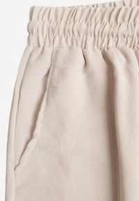 Renee - Beżowe Szerokie Spodnie z Wiskozą z Gumką w Pasie Lealirre. Okazja: na co dzień. Kolor: beżowy. Materiał: wiskoza. Wzór: gładki. Styl: casual #2