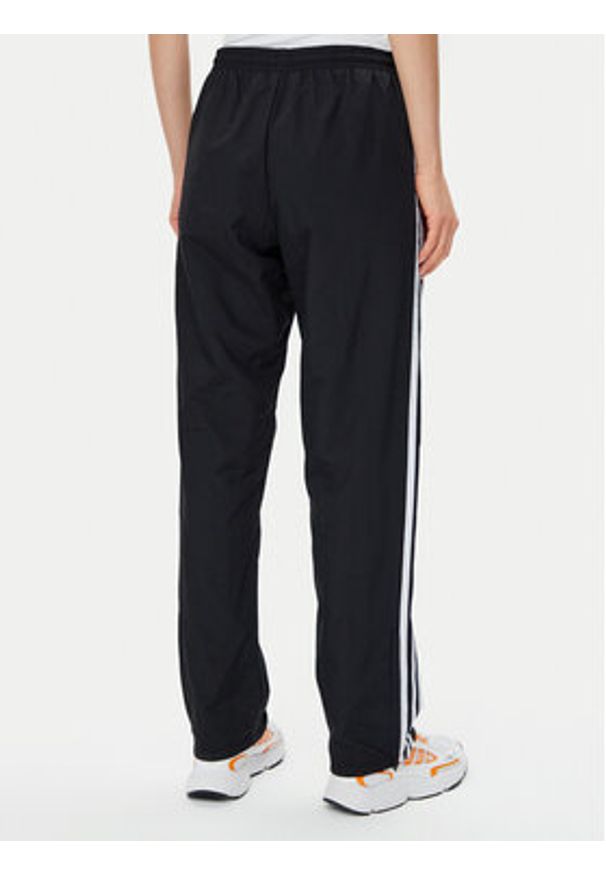Adidas - adidas Spodnie dresowe Woven JD5335 Czarny Loose Fit. Kolor: czarny. Materiał: syntetyk