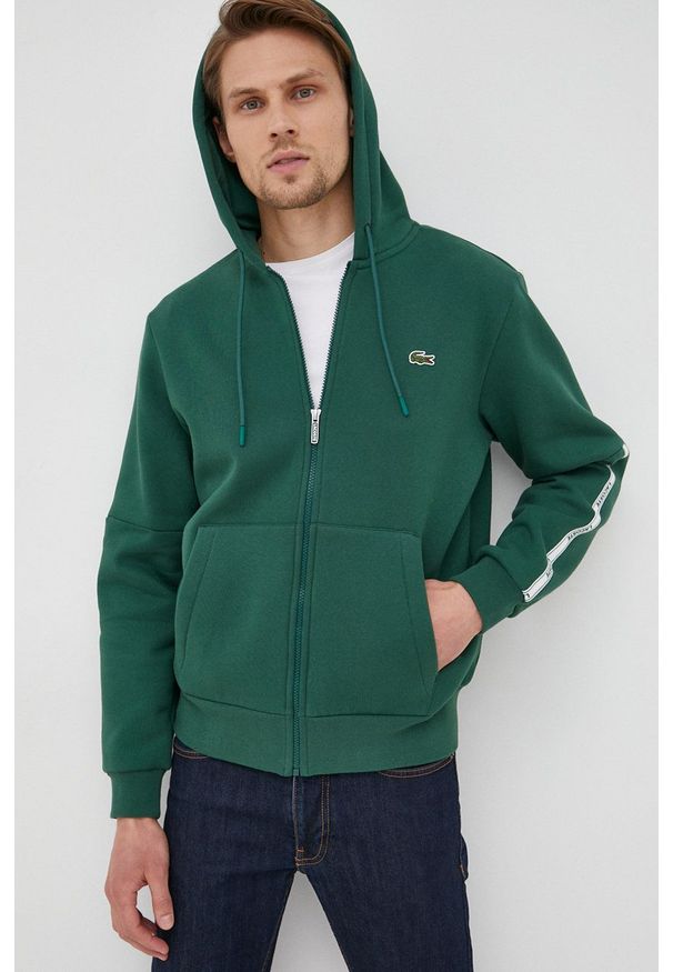 Lacoste bluza męska kolor zielony z kapturem z aplikacją. Okazja: na co dzień. Typ kołnierza: kaptur. Kolor: zielony. Materiał: dzianina. Wzór: aplikacja. Styl: casual