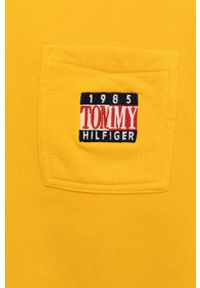 TOMMY HILFIGER - Tommy Hilfiger Bluza bawełniana dziecięca kolor pomarańczowy z kapturem z aplikacją. Okazja: na co dzień. Typ kołnierza: kaptur. Kolor: pomarańczowy. Materiał: bawełna. Wzór: aplikacja. Styl: casual
