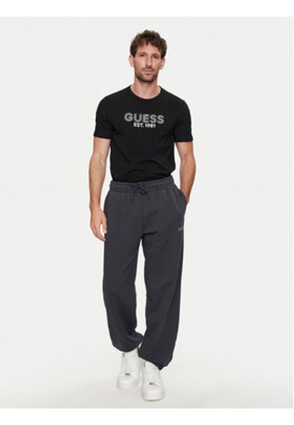 Guess T-Shirt M4YI30 J1314 Czarny Slim Fit. Kolor: czarny. Materiał: bawełna