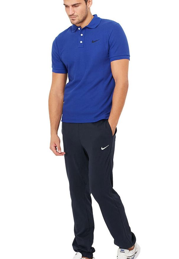 Spodnie Dresowe Sportowe Męskie Nike Bawełniane Regular. Kolor: niebieski. Materiał: dresówka, bawełna. Sport: fitness