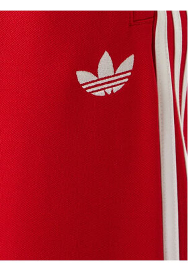 Adidas - adidas Spodnie dresowe adicolor KE3498 Czerwony Loose Fit. Kolor: czerwony. Materiał: bawełna