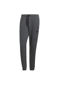 Adidas - Spodnie męskie adidas Essentials Tapered Cuff 3 Stripes. Kolor: czarny, szary, wielokolorowy. Materiał: wiskoza, polar, poliester, bawełna. Sport: joga i pilates, fitness