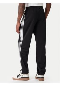 Adidas - adidas Spodnie dresowe Firebird KD8315 Czarny Loose Fit. Kolor: czarny. Materiał: syntetyk #4