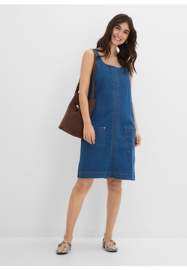 bonprix - Sukienka ogrodniczka uszyta z bawełnianego dżinsu o długości do kolan. Okazja: na spotkanie biznesowe, do pracy. Kolor: niebieski. Materiał: bawełna. Styl: biznesowy. Długość: midi