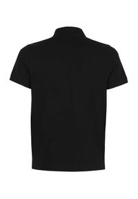 MONCLER - Czarny t-shirt polo. Typ kołnierza: polo. Kolor: czarny. Materiał: bawełna. Wzór: aplikacja. Styl: klasyczny