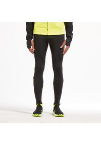KIPRUN - Legginsy do biegania męskie Kiprun Warm ocieplane. Kolor: czarny, wielokolorowy, żółty. Materiał: poliester, elastan, materiał. Sport: bieganie, fitness