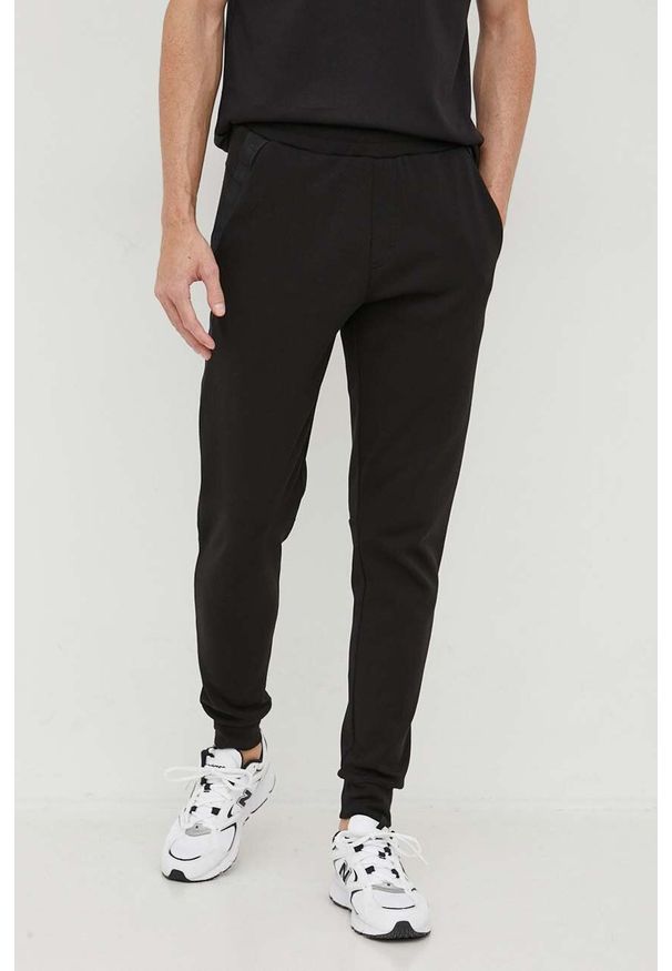 Calvin Klein spodnie dresowe kolor czarny gładkie. Kolor: czarny. Materiał: dresówka. Wzór: gładki
