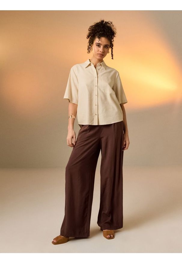 Sinsay - Wiskozowe spodnie wide leg - brązowy. Kolor: brązowy