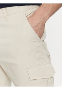 Tommy Jeans Spodnie materiałowe Austin DM0DM18940 Beżowy Slim Fit. Kolor: beżowy. Materiał: bawełna
